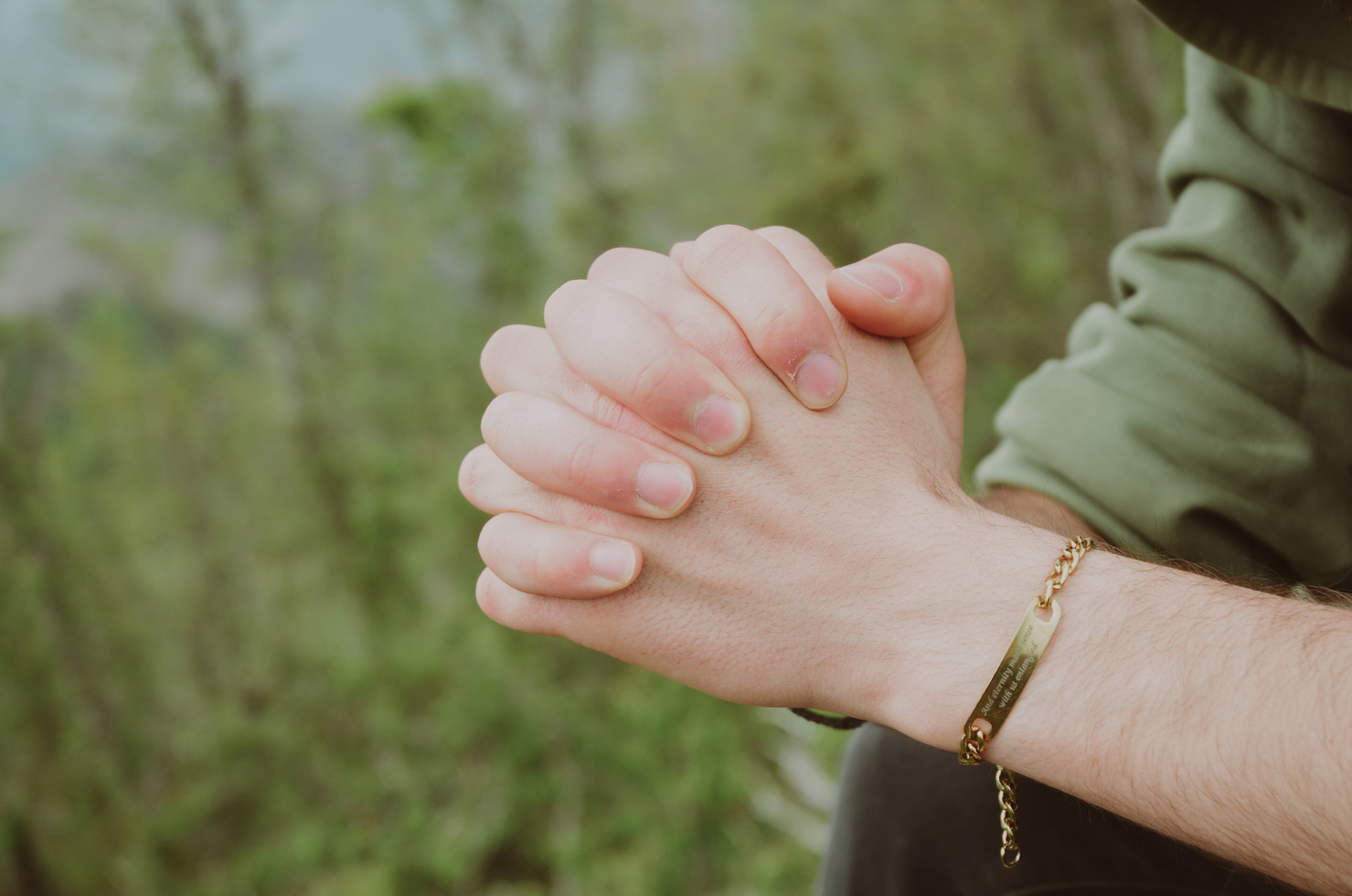 Person's Praying Hands in Close-up Photography